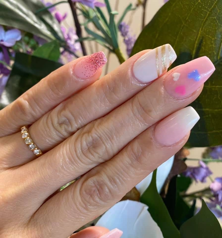 Pastel nail set with gold accents and gemstones